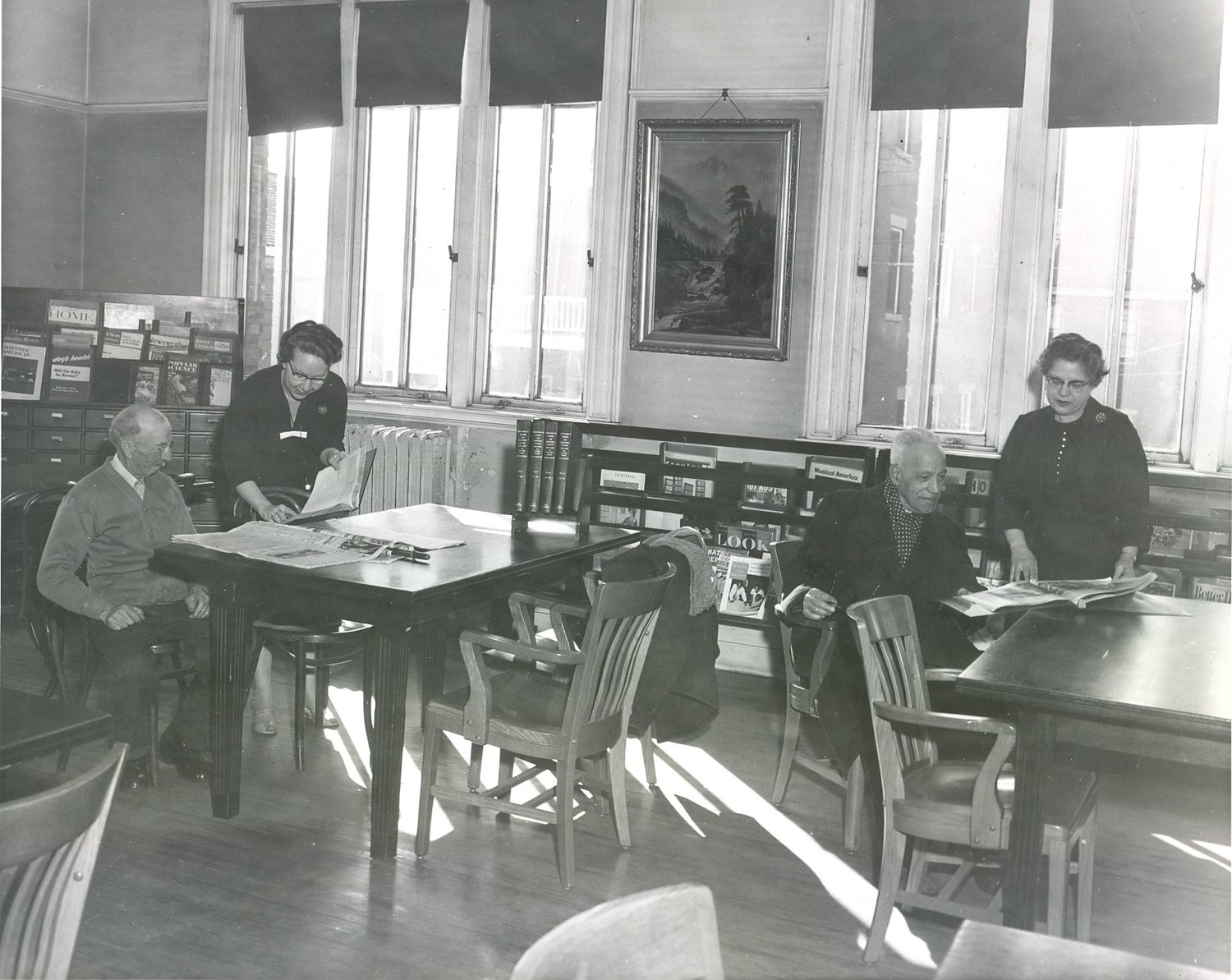 Gloversville Free Library Reading Room circa 1940s showing on the Right Catherine Costello Library Director